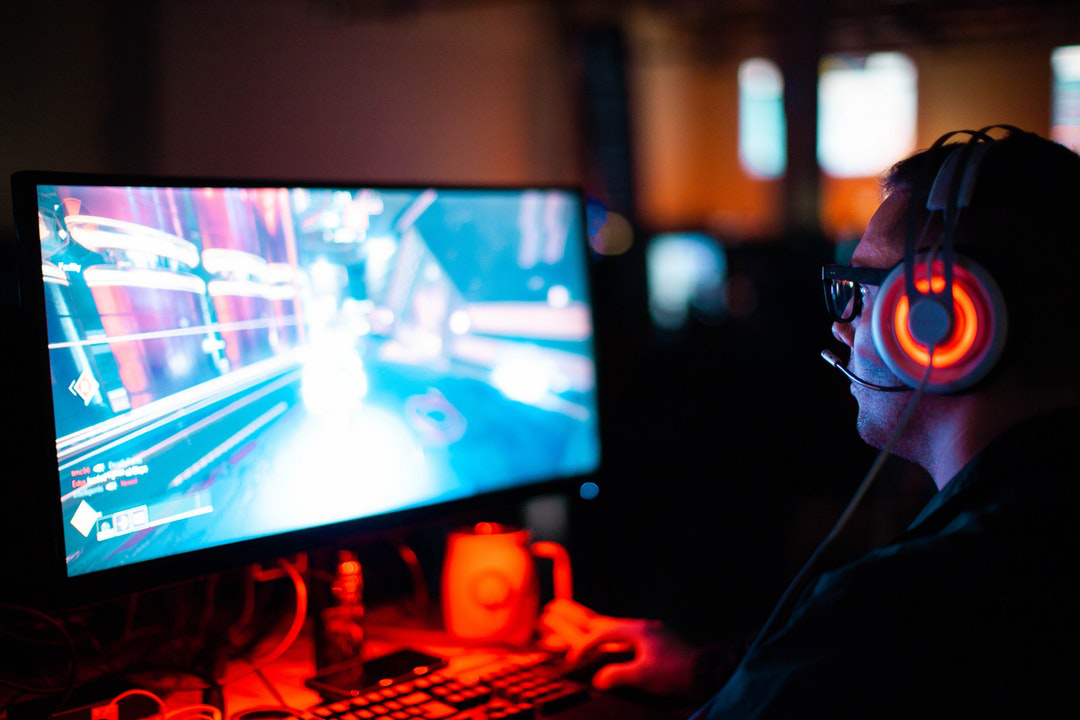 person in front of computer playing  video games